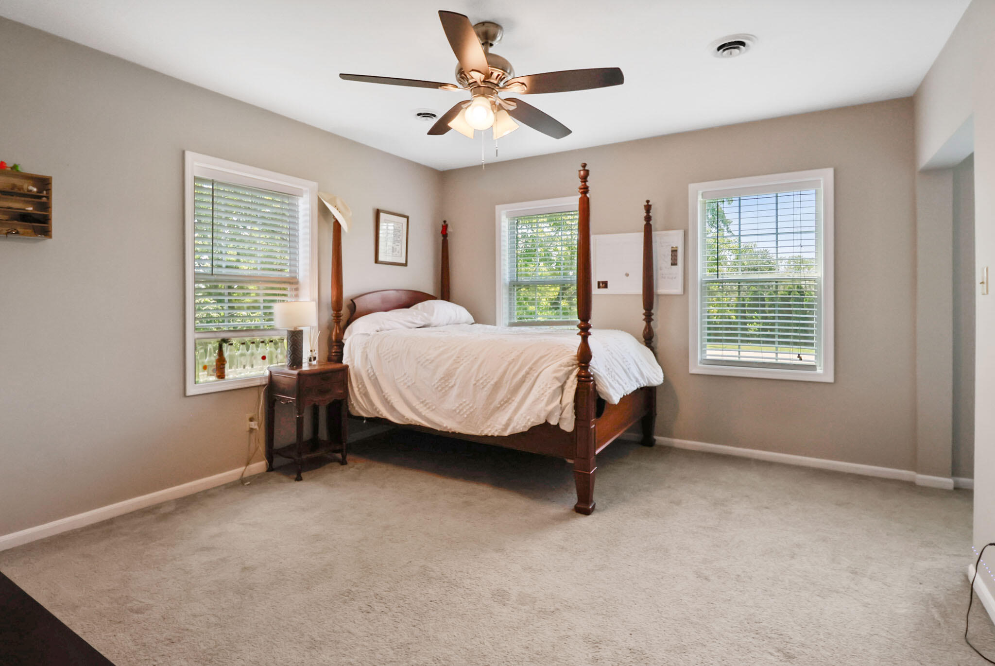 12819 Grant Street Crown Point, IN 46307 - Photo 23 of 42 a bed sitting in a bedroom next to a window