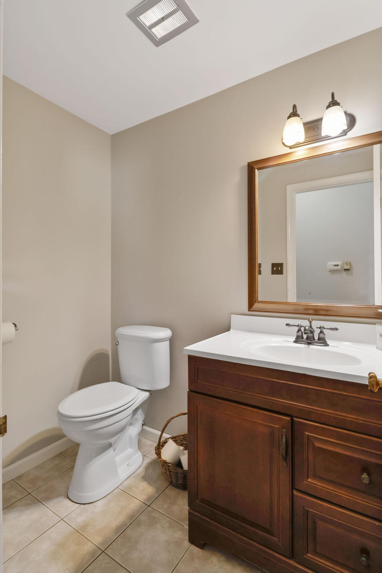12819 Grant Street Crown Point, IN 46307 - Photo 27 of 42 a bathroom with a sink toilet and mirror