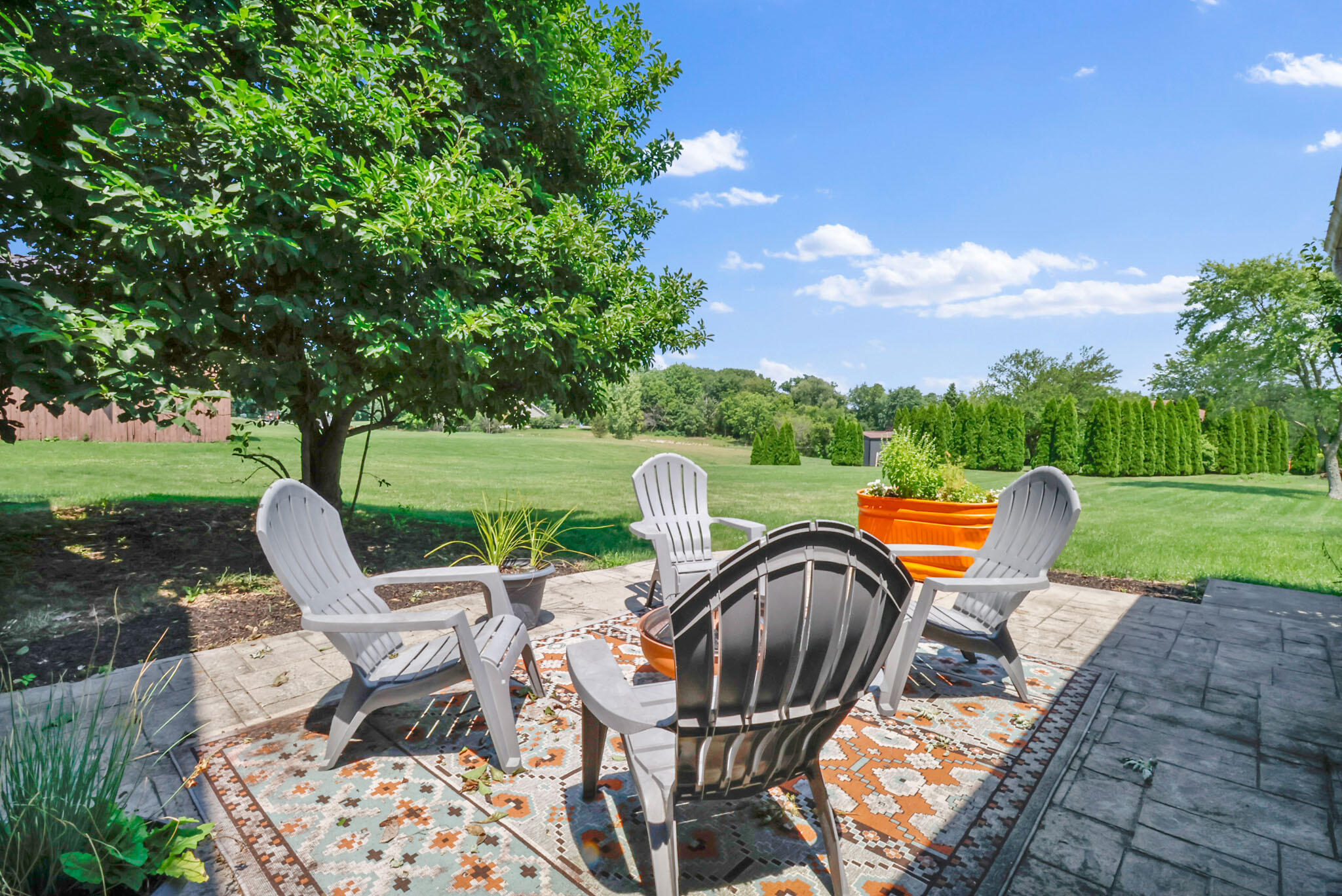 12819 Grant Street Crown Point, IN 46307 - Photo 28 of 42 a view of a chairs and table in the patio