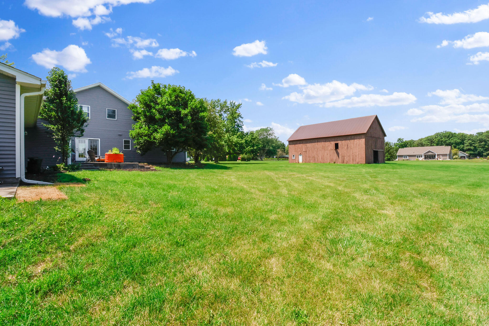 12819 Grant Street Crown Point, IN 46307 - Photo 30 of 42 a backyard of a house with lots of green space