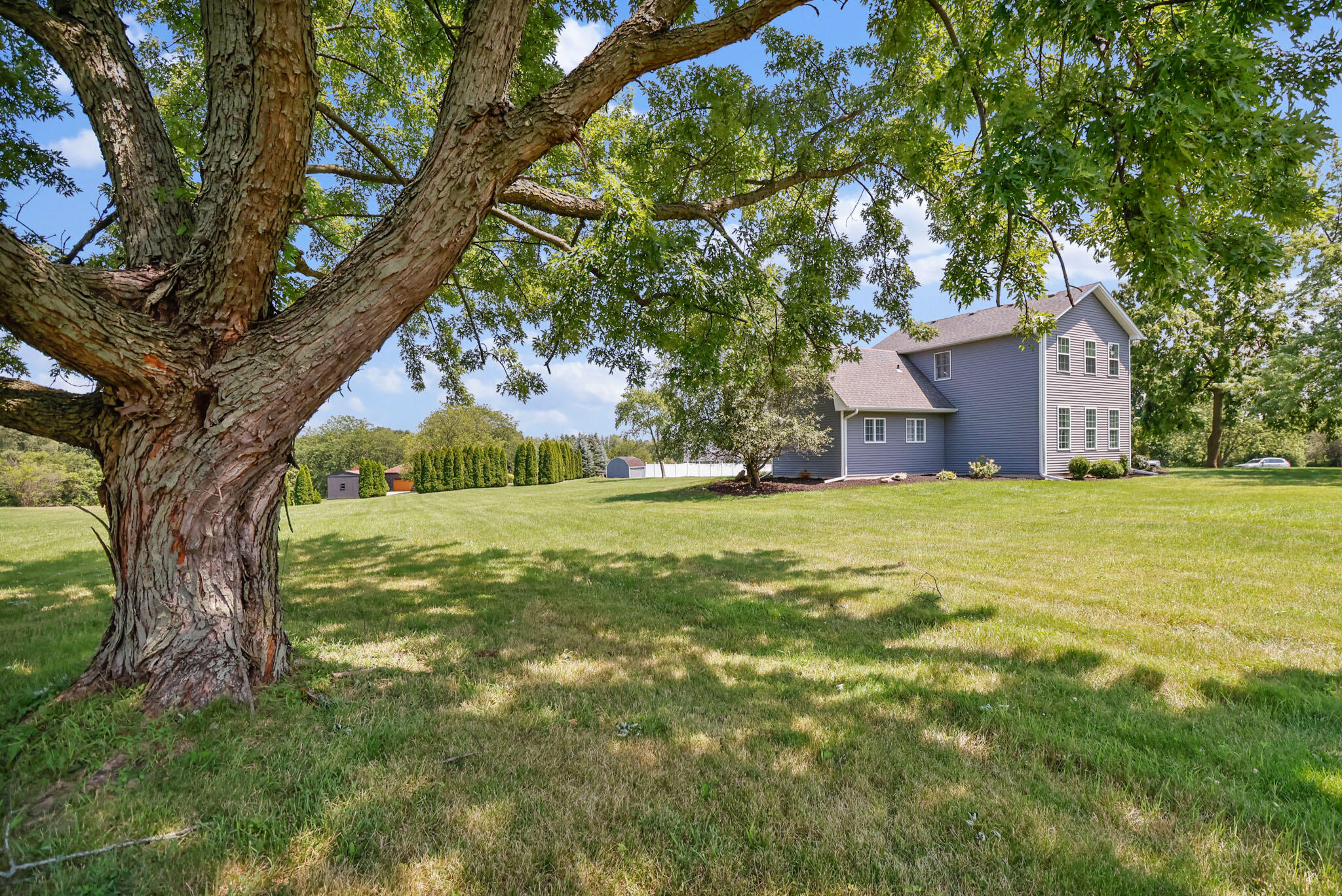 12819 Grant Street Crown Point, IN 46307 - Photo 37 of 42 a view of a house with a yard