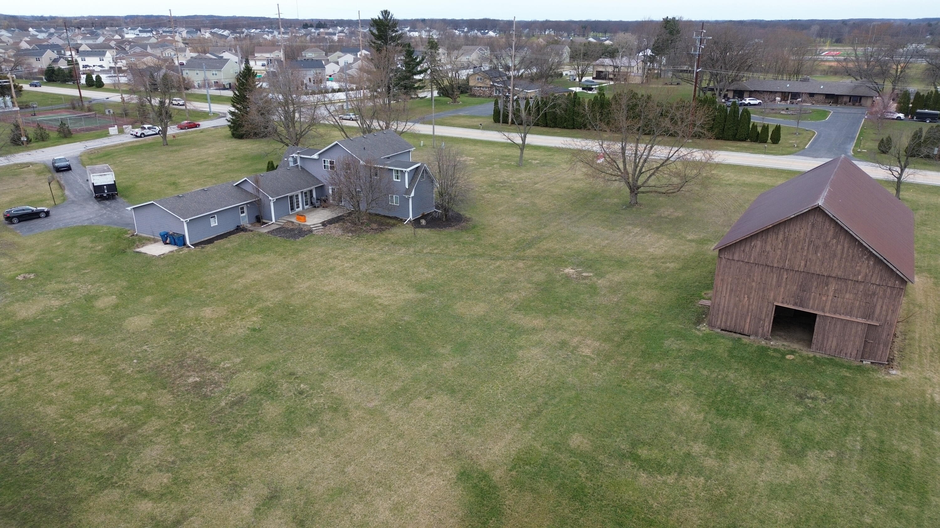 12819 Grant Street Crown Point, IN 46307 - Photo 41 of 42 an aerial view of a house with outdoor space patio and mountain view