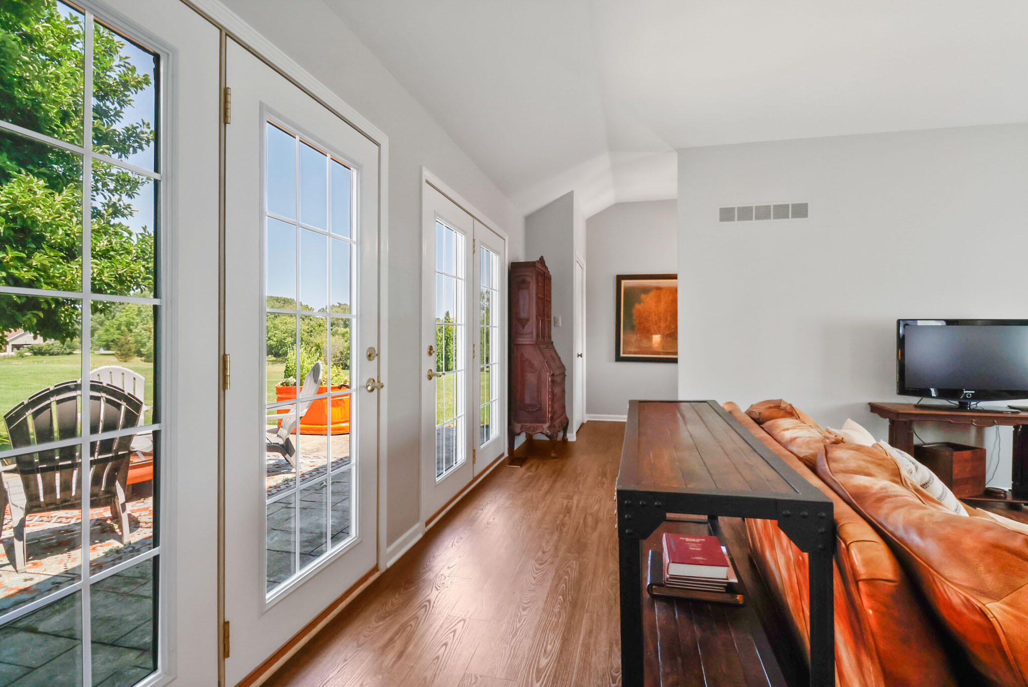 12819 Grant Street Crown Point, IN 46307 - Photo 5 of 42 a bed room with furniture and a flat screen tv