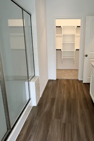 a view of a room with wooden floor and staircase