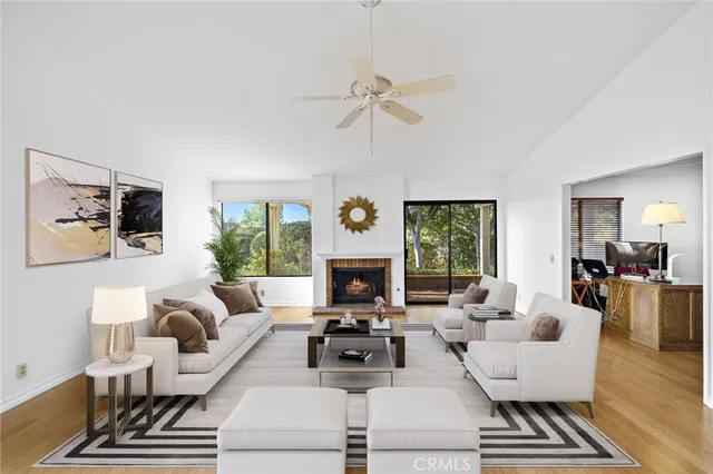 a living room with furniture fireplace and window