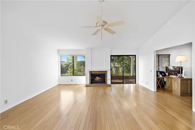 a view of a living room a window and a fireplace