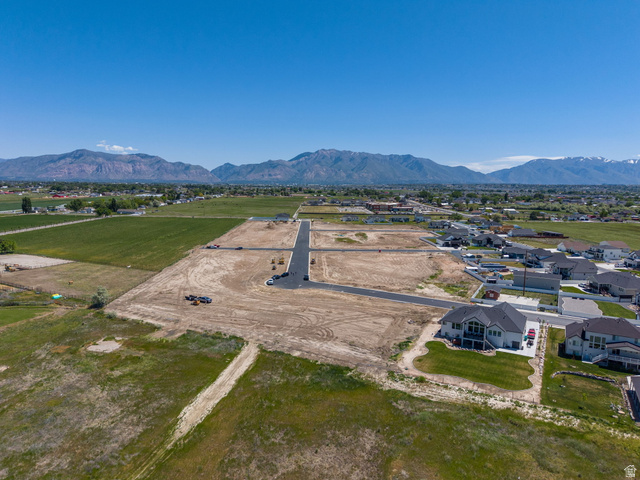 3150 South 5250 West, Unit 210 Hooper, UT 84315 - Photo 11 of 11 Expansive undeveloped land parcels with newly paved roads, surrounded by green fields
