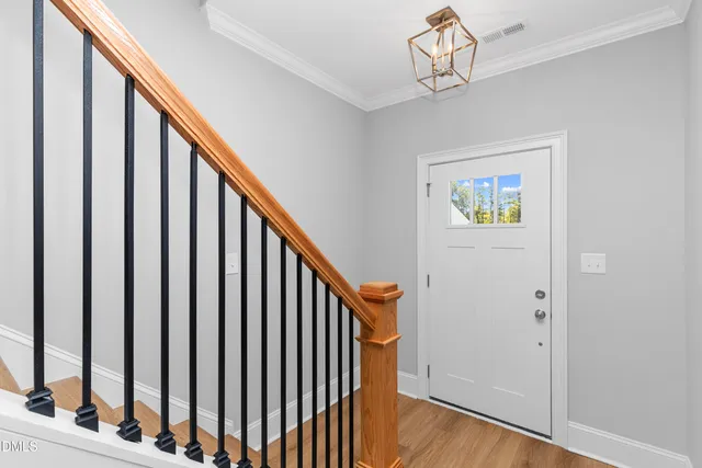 a view of staircase with rug