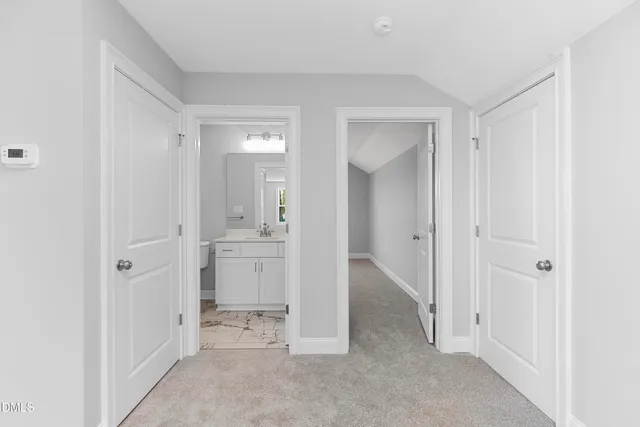 a view of a room with white doors