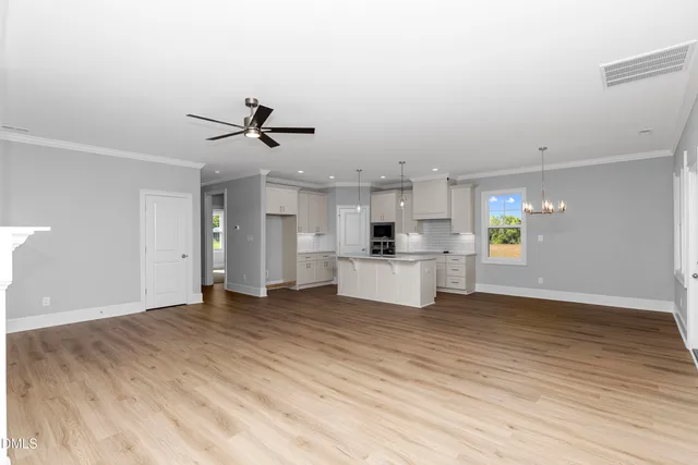 a view of a kitchen with microwave and a stove