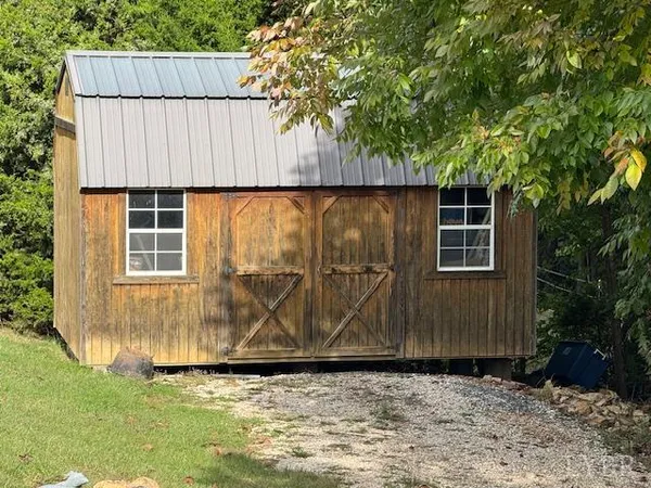 a wooden door in front of a house