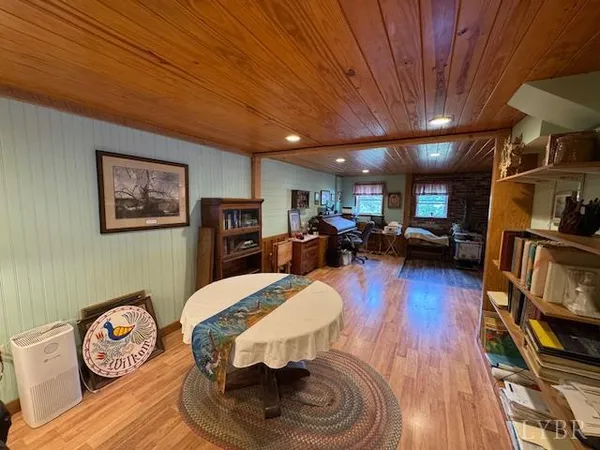 a living room with furniture flat screen tv and a fireplace