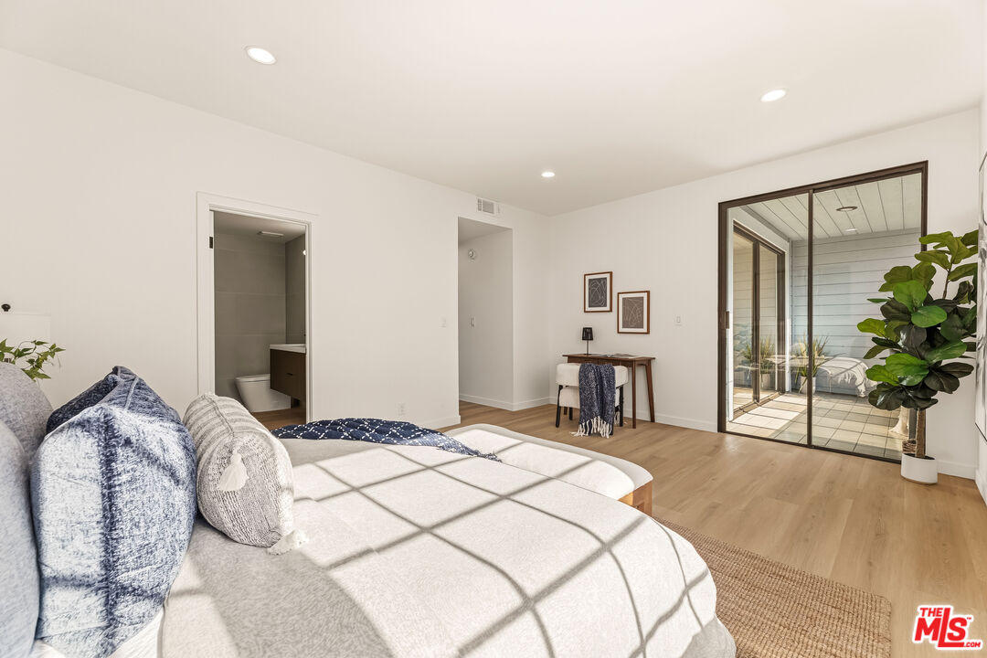 311 Bora Bora Way, Unit 3207 Marina del Rey, CA 90292 - Photo 23 of 54 a bedroom with a bed and a potted plant