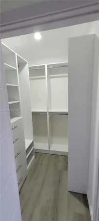 a view of an empty walk in closet