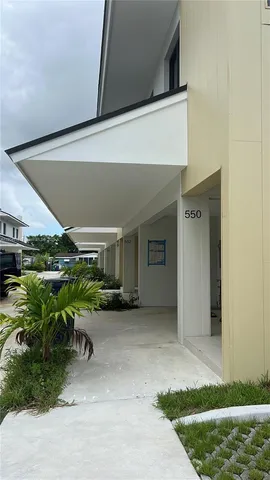 a view of backyard with wheel chair and potted plants