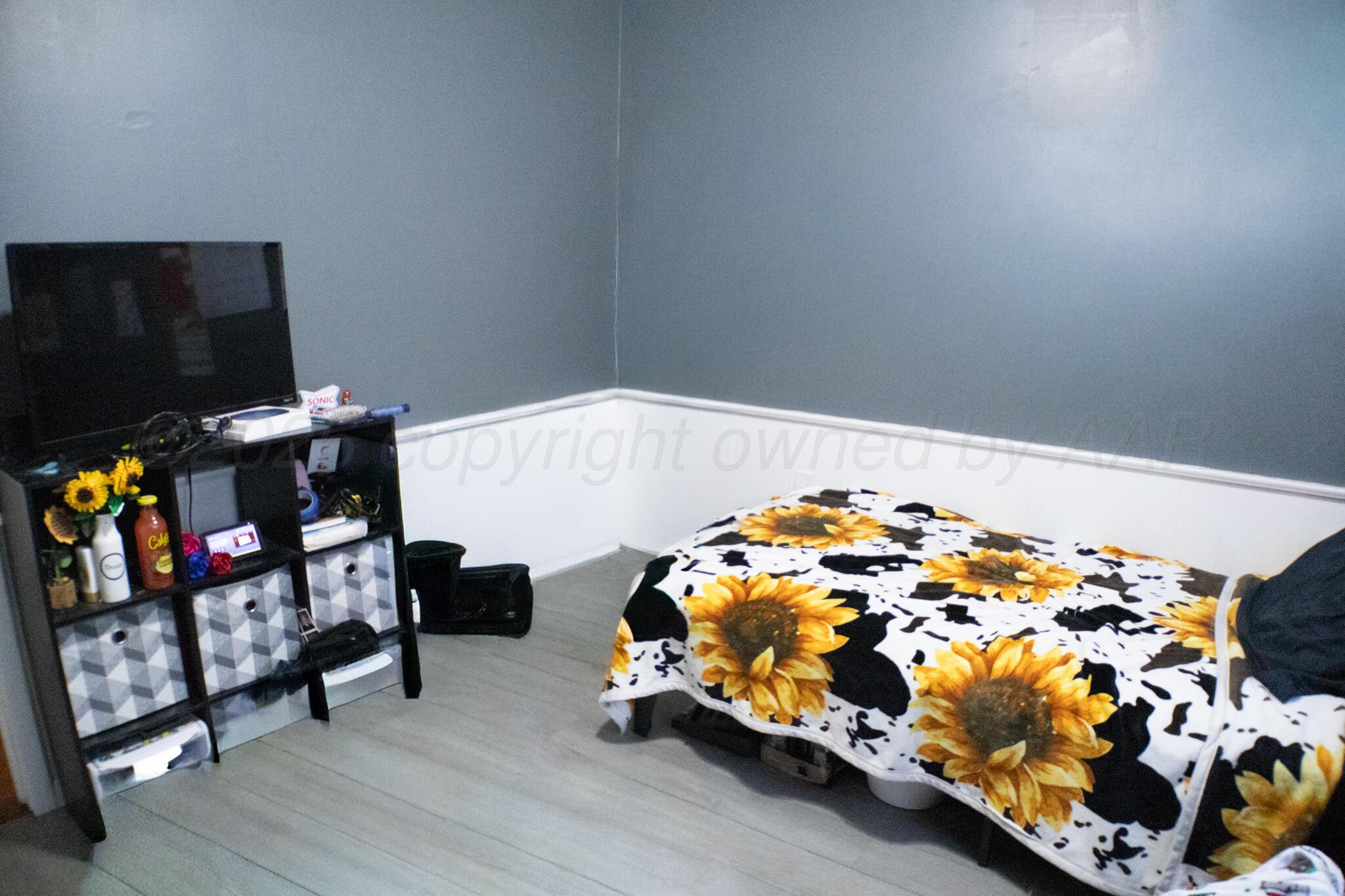 4711 South Rusk Street Amarillo, TX 79110 - Photo 23 of 24 a bedroom with bed and a window