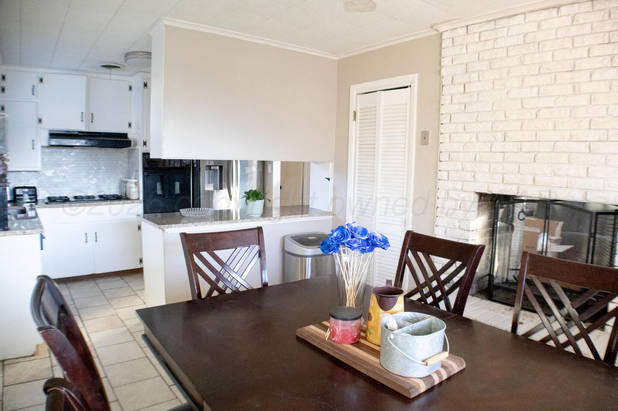 4711 South Rusk Street Amarillo, TX 79110 - Photo 7 of 24 a living room with furniture and kitchen view