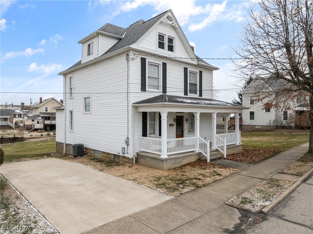 1011 Parriott Avenue Moundsville, WV 26041 - Photo 2 of 44 Traditional style home featuring covered porch and a shingled roof