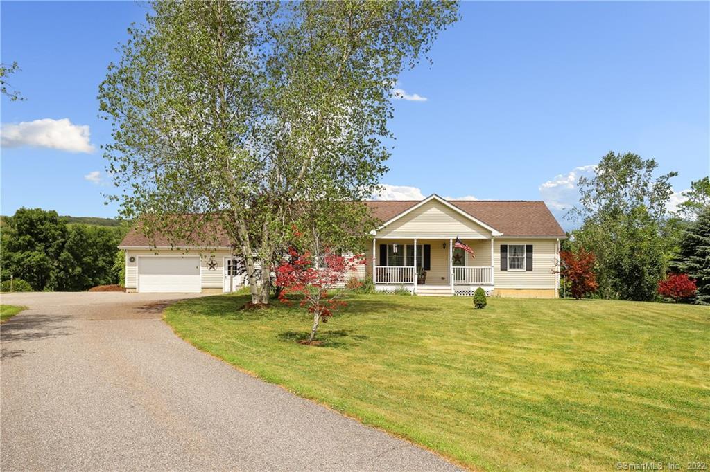 35 Countryview Road Millerton, NY 12546 - Photo 1 of 1 a front view of a house with a garden and trees