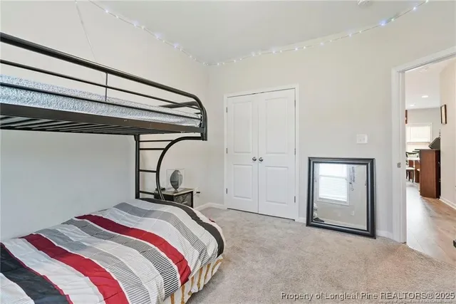 a bedroom with a bed and a mirror