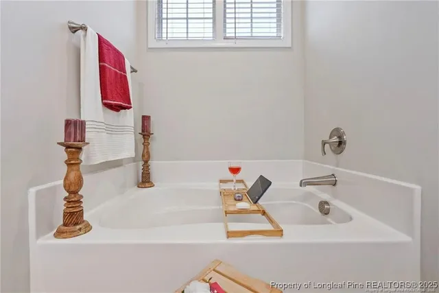 a bathroom with a bathtub and a sink