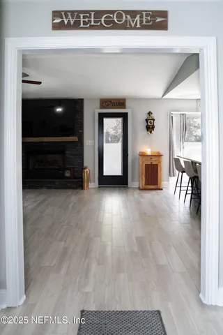a view of a livingroom with furniture and a flat screen tv