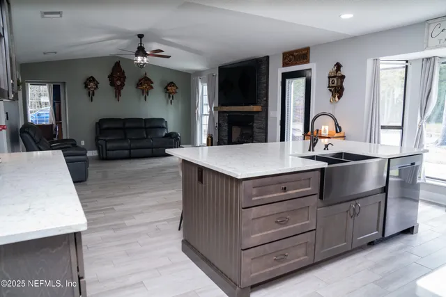 a living room with furniture and a fireplace