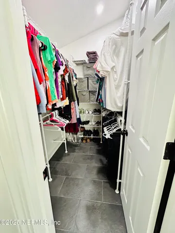 a bedroom with a bed and a table