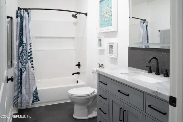 a kitchen with a stove and cabinets