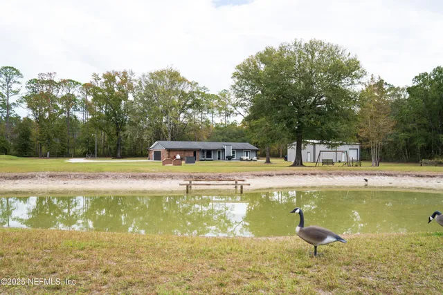 a swimming pool with an outdoor space and seating area