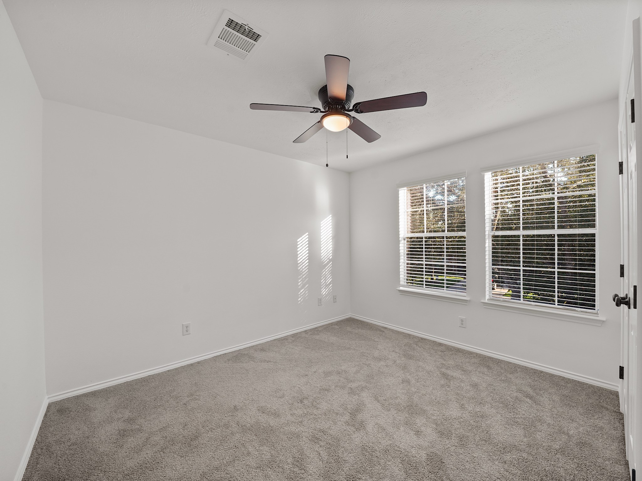 14206 Windy Ridge Lane Rosharon, TX 77583 - Photo 12 of 15 This freshly updated bedroom features new paint and carpet for a modern touch.