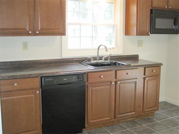 149 Wheeler Avenue Springfield, MA 01118 - Photo 3 of 6 a kitchen with a sink and cabinets