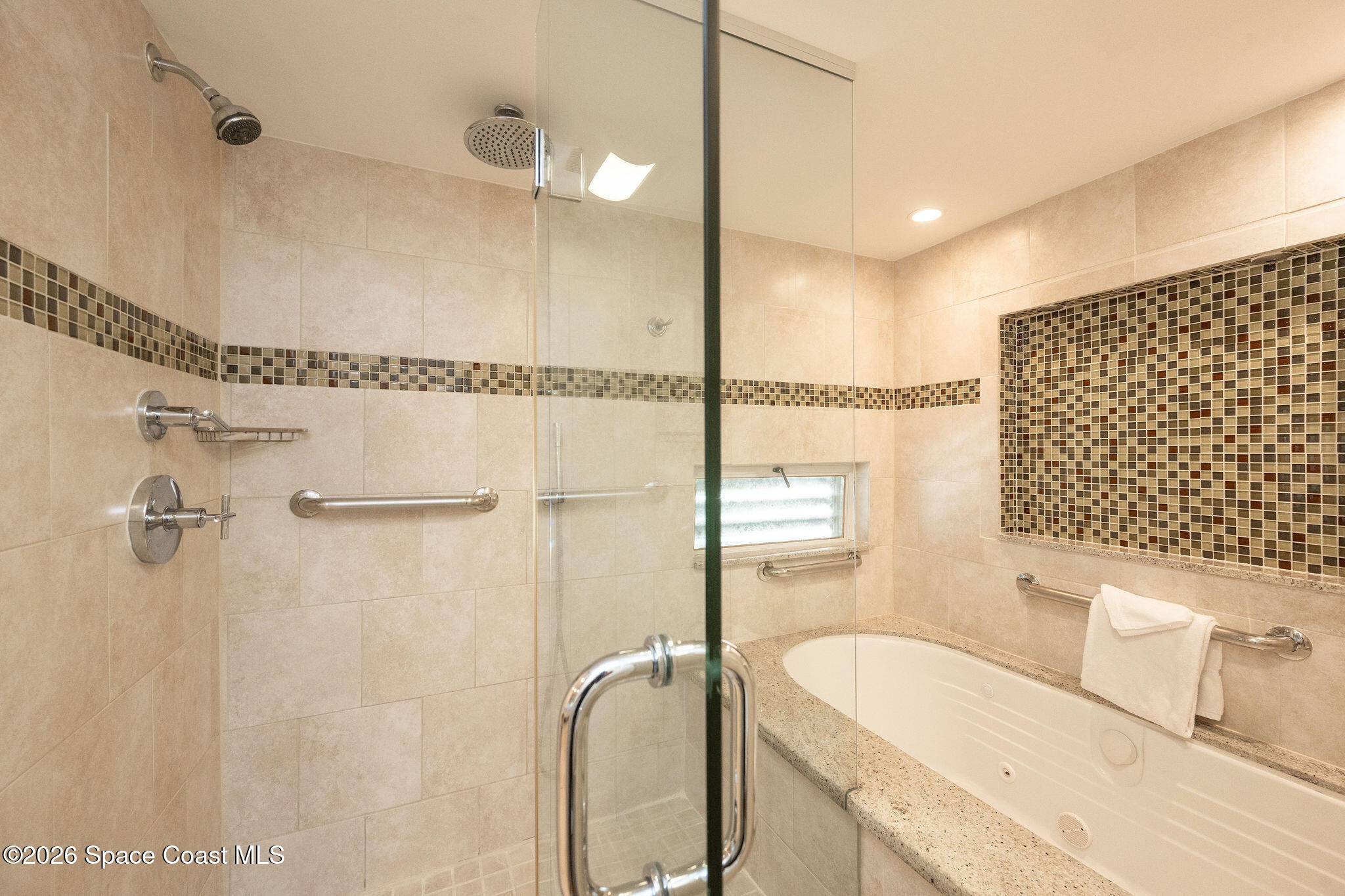 617 Front Street, Unit B51 Key West, FL 33040 - Photo 23 of 56 a bathroom with a granite countertop sink a toilet and shower