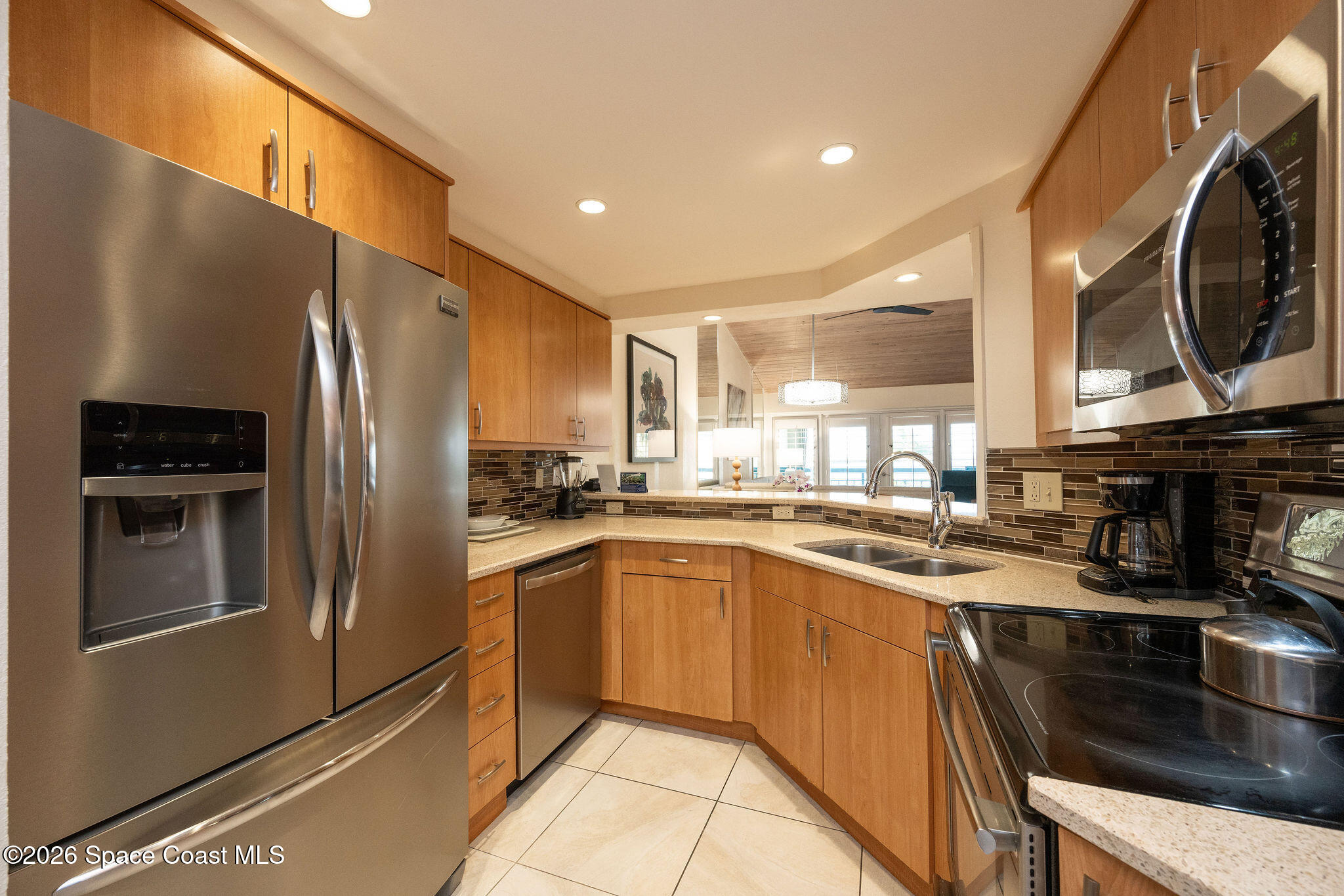 617 Front Street, Unit B51 Key West, FL 33040 - Photo 33 of 56 a kitchen with stainless steel appliances granite countertop a refrigerator a stove and a sink