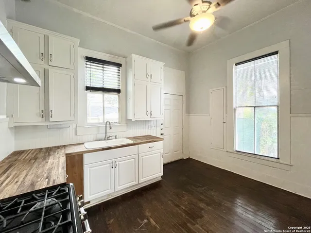 a kitchen with sink cabinets and window