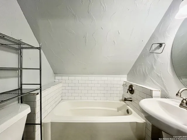 a bathroom with a sink and a bathtub