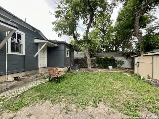 a backyard of a house with seating space