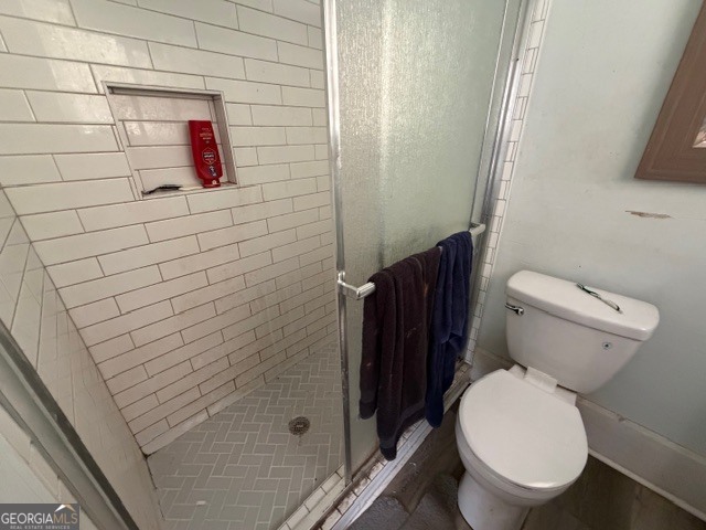 312 Grady Avenue Northeast Rome, GA 30161 - Photo 7 of 12 a bathroom with a toilet and a shower