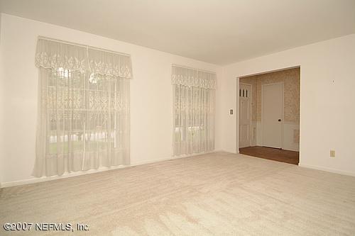 4032 Heath Road Jacksonville, FL 32277 - Photo 8 of 14 a view of an empty room with a window