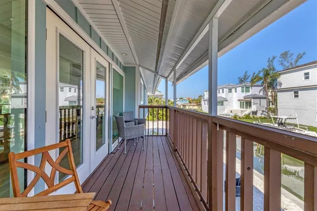 a view of a balcony with wooden floor