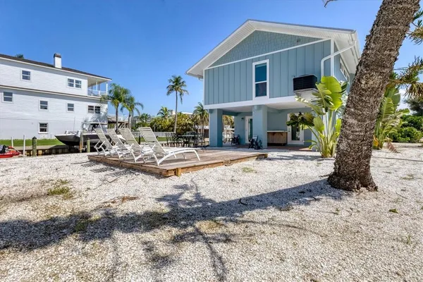 a view of a house with a yard and plants