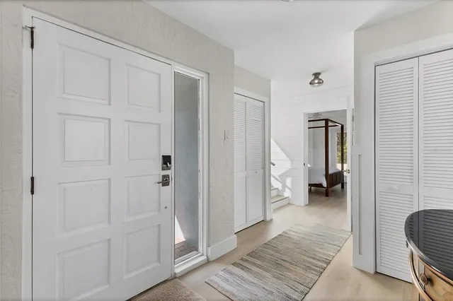 a view of a hallway with bathroom