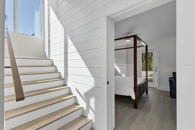 a view of entryway and hall with wooden floor