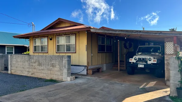 a front view of a house with yard