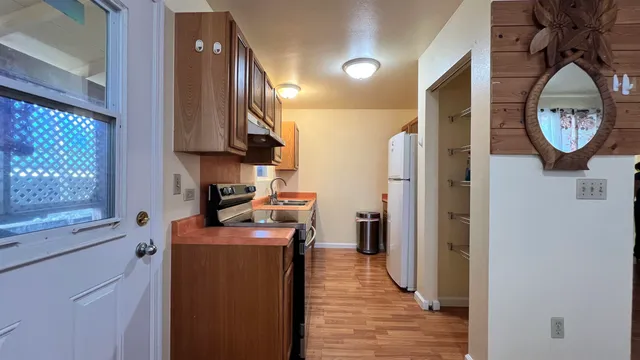 a view of a kitchen with washer and dryer