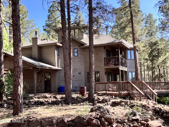 a front view of a house with yard