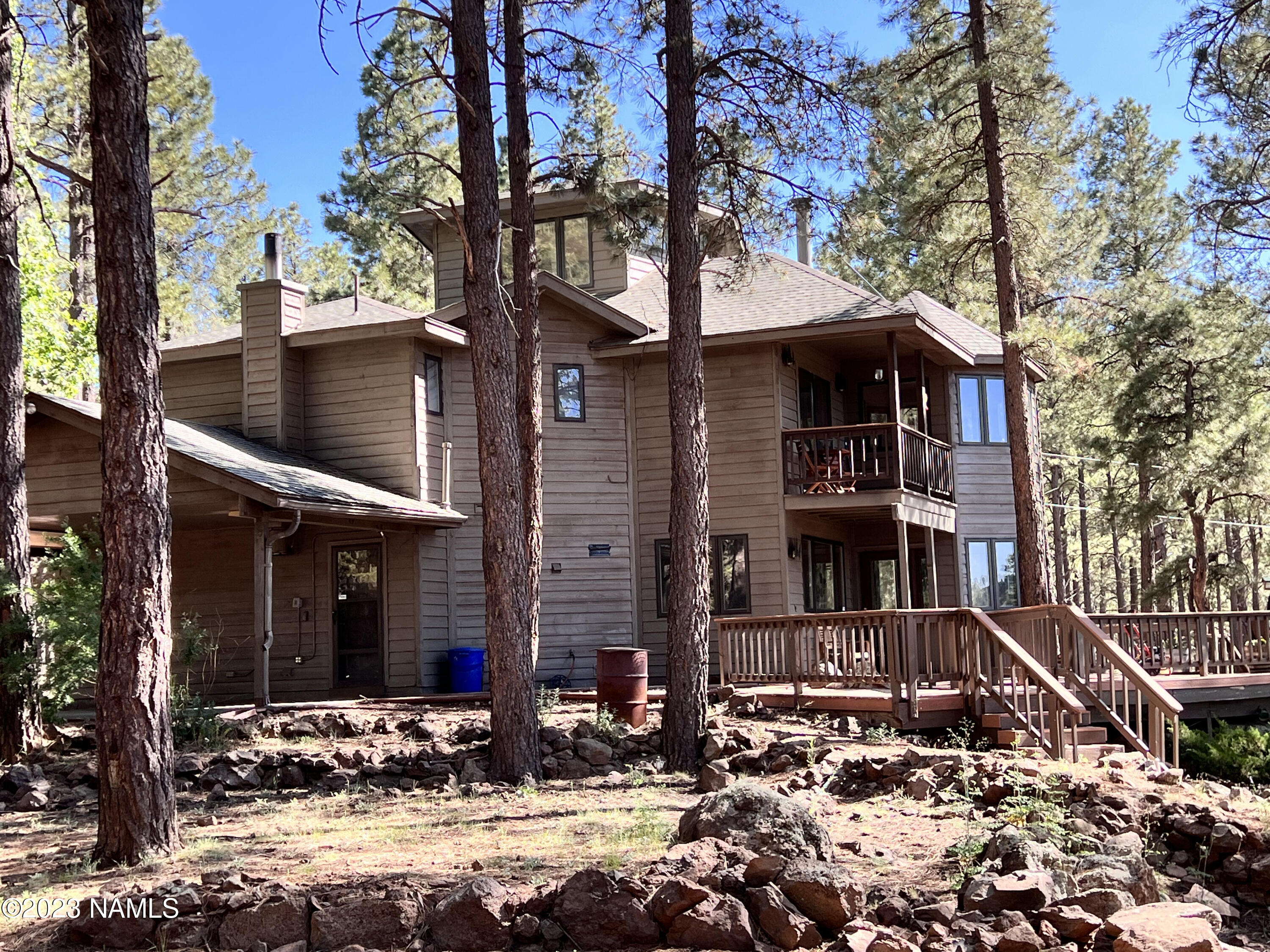 12830 East Thunder Rdg Road Parks, AZ 86018 - Photo 2 of 97 a front view of a house with street