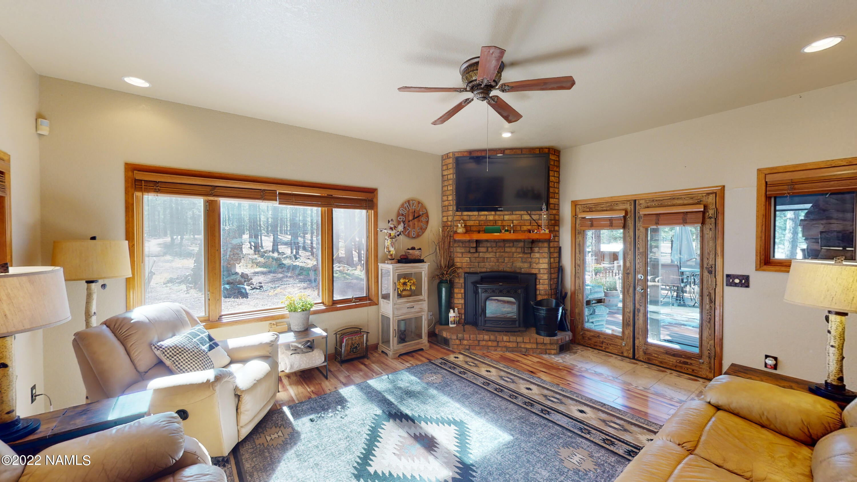 12830 East Thunder Rdg Road Parks, AZ 86018 - Photo 24 of 97 a living room with furniture large window and a fireplace