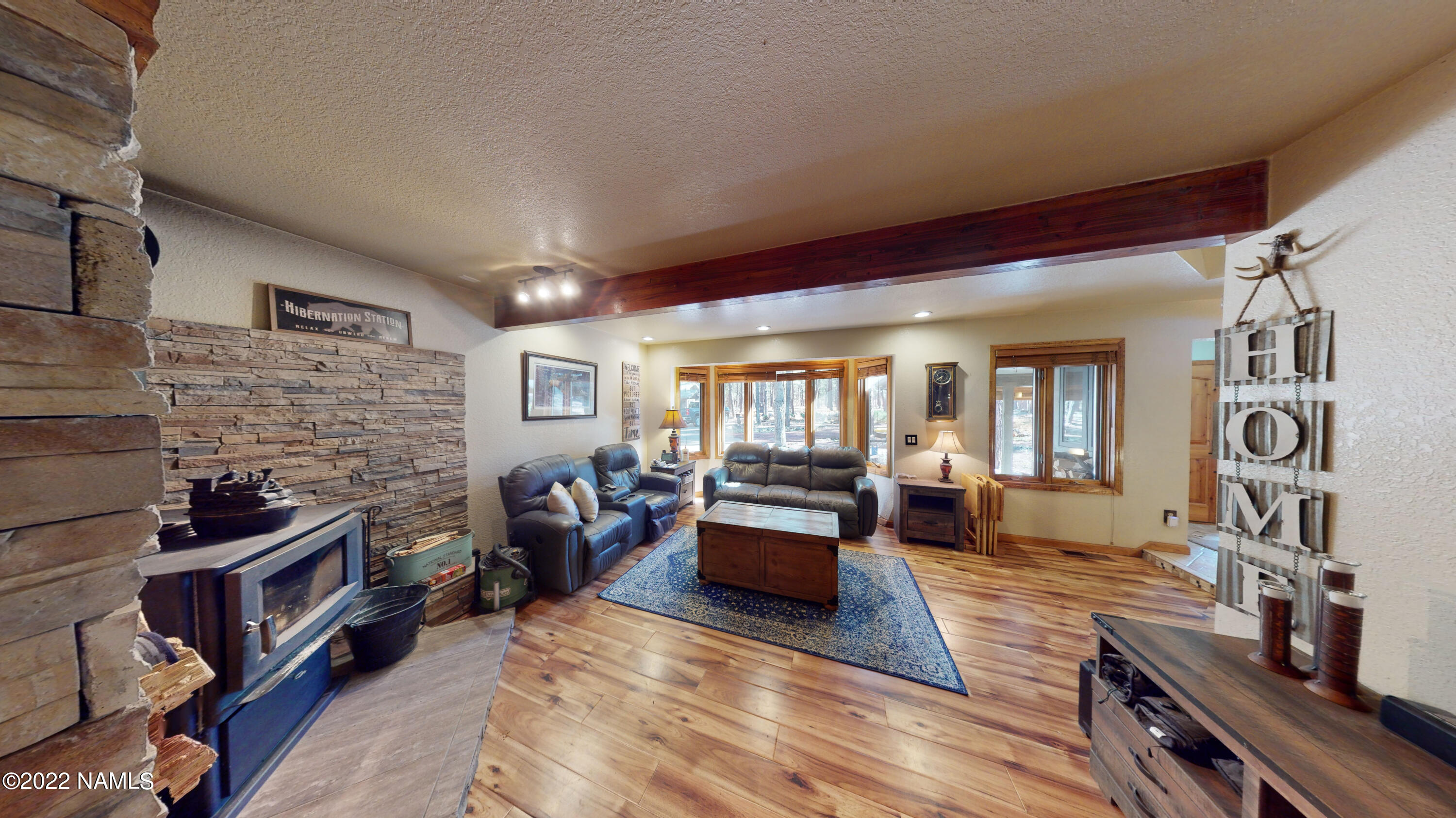 12830 East Thunder Rdg Road Parks, AZ 86018 - Photo 26 of 97 a living room with furniture and a fireplace