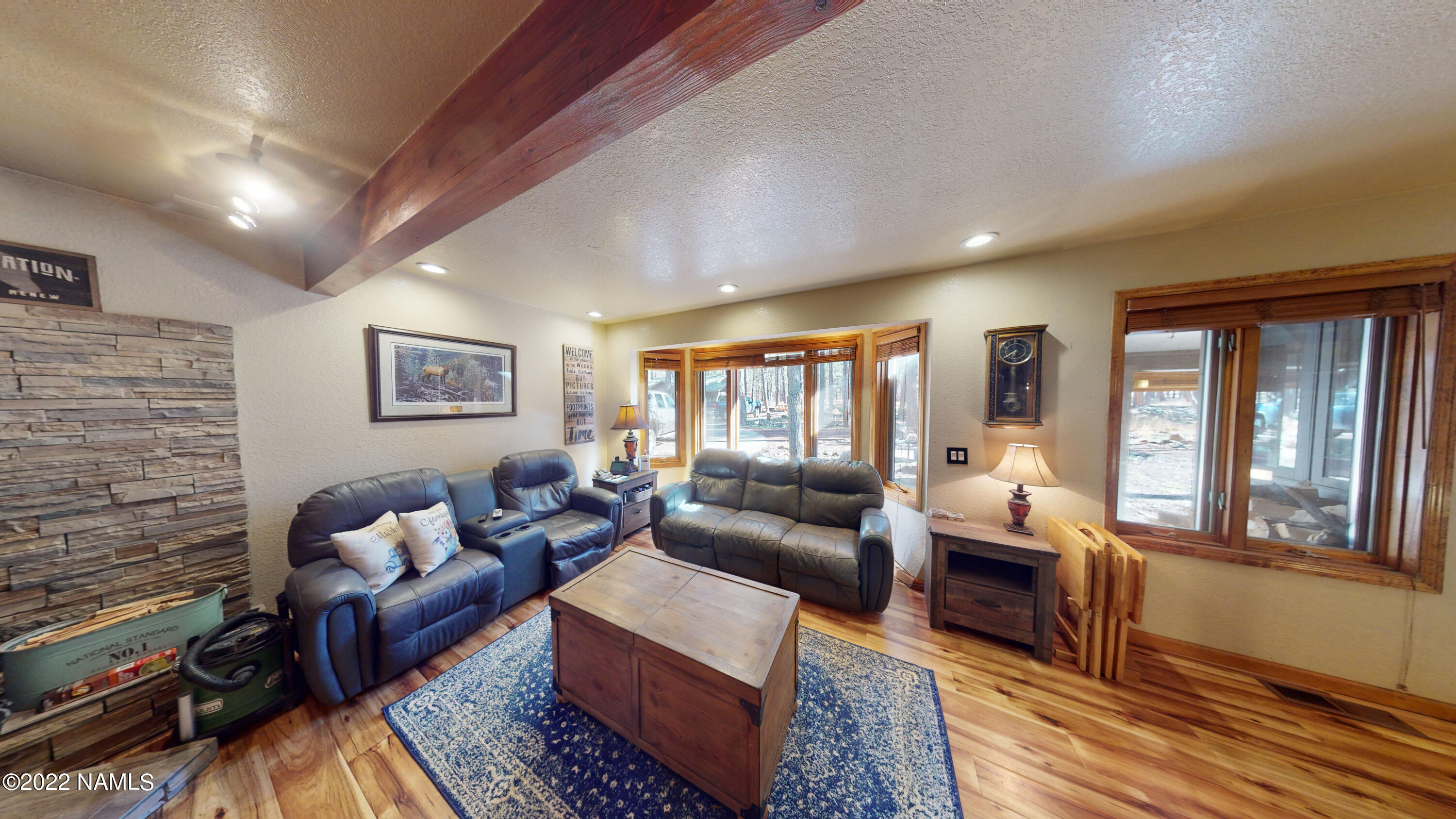 12830 East Thunder Rdg Road Parks, AZ 86018 - Photo 27 of 97 a living room with furniture or couch and a fireplace